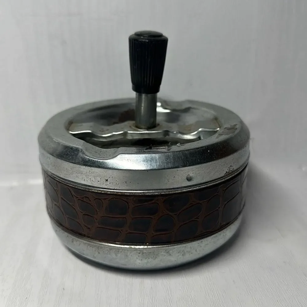 Gold Coin Metal ashtray with a snake-like pattern with a twist Made in Hong Kong